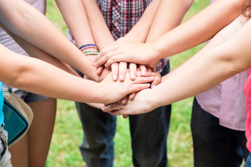 Teens' hands toghether